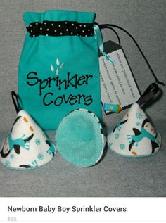 a blue bag with white and black polka dots on it next to three little shoes