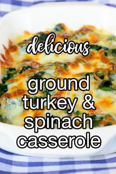 a casserole dish with spinach and cheese in it on a blue checkered table cloth