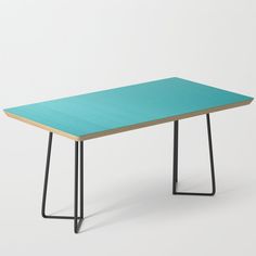 a blue table with black metal legs and a wooden top, on a white background