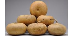 a pile of potatoes sitting on top of each other