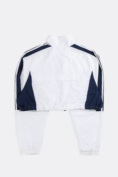 Reworked Adidas cropped windbreaker jacket with adjustable cord and toggle drawstring bottom. Sourced and reworked in CanadaMeasurementsSize: XLPit to Pit: 24.5"Arm: 28"Length: 17.5"Condition: Minor stains, good vintage conditionMaterial Composition: 100% NylonColour: White, Navy Athleisure Windbreaker With Drawstring For Streetwear, Athleisure Windbreaker With Functional Drawstring For Streetwear, Sporty Drawstring Outerwear For Streetwear, Streetwear Long Sleeve Track Jacket With Drawstring, Long Sleeve Track Jacket With Drawstring For Streetwear, Athleisure Drawstring Outerwear For Streetwear, Sporty Track Jacket With Drawstring For Streetwear, Urban Windbreaker With Drawstring For Streetwear, Sporty White Outerwear With Drawstring