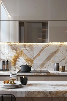 a kitchen with marble counter tops and gold accents on the backsplash is pictured in this image