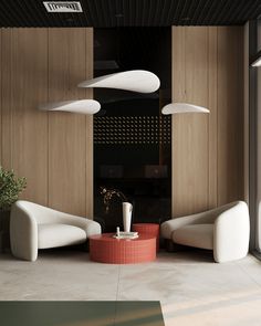 a living room filled with white furniture next to a wooden paneled wall and floor