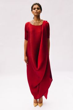 Shop for these amazing collections of Red Pleated Polyester Round Draped Dress For Women by Kiran Uttam Ghosh online at Aza Fashions. Pre-draped Maxi Dress With Folds, Pre-draped Cowl Neck Dress For Gala, Festive Chic Dress With Traditional Drape, Chic Party Dress With Traditional Drape, Red Pre-draped Maxi Dress, Pre-draped Asymmetrical Maxi Dress For Cocktail, Draped Maxi Dress With Folds For Gala, Elegant Fitted Maxi Dress With Traditional Drape, Gala Maxi Dress With Folds