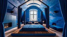 a bedroom with blue walls and furniture in the room is lit by two large windows