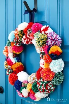 a colorful wreath hanging on the front door