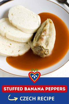 stuffed banana peppers on a white plate with gravy next to some pita bread