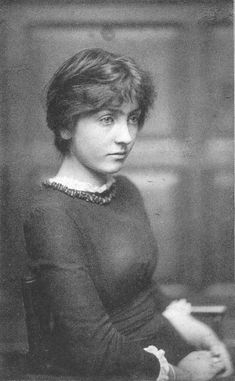 an old black and white photo of a woman