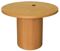 a round wooden table with a hole in the center