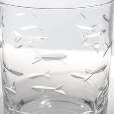 a glass filled with water sitting on top of a table