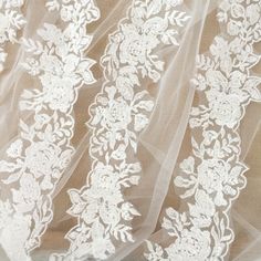 Super beautiful beaded alencon lace trim in ivory , with adorable beaded lace details, all the pearls are in ivory color, scallop on both sides . I think this great lace is ideal for wedding decors, bridal accessories, wedding gown straps, hems, veils, garters . Width is about 5 cm,  buying more will be cut as one piece . my shop link: http://www.etsy.com/shop/lacetime Thank for shopping and have a nice day forever ! ------------------------------------------------------ ------------------------ Wedding Lace With Scalloped Tulle, White Lace Trim Tulle, Tulle Lace With Lace Trim For Wedding, Wedding Tulle With Scalloped Lace, Wedding Tulle Lace With Scalloped Edges, Wedding Tulle Lace With Scalloped Detail, Fitted Tulle Fabric With Lace Trim For Wedding, Wedding Lace With Tulle And Lace Trim, Lace Wedding Dress With Lace Trim For Bride