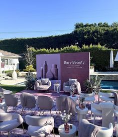 chairs and tables are set up in front of a large sign that says rose beauty