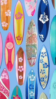 many surfboards are lined up against a blue background with flowers and leaves on them