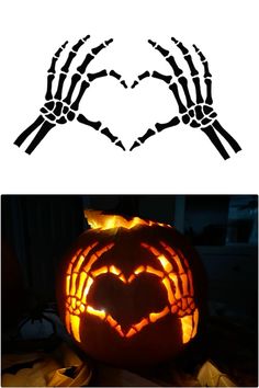 two pumpkins carved to look like hands with a heart in the middle, and one has