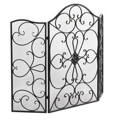 an iron fireplace screen with scroll designs on the front and back sides, set against a white background