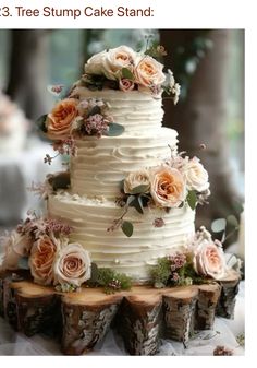 a three tiered cake with flowers and greenery on top is sitting on wood slices