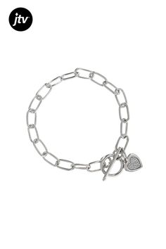 0.10ctw round white diamond, rhodium over sterling silver heart charm bracelet. Heart measures approximately 3/4"L x 7/16"W. Bracelet measures approximately 1/4"W and has a toggle clasp closure. Bracelet Heart, Sterling Silver Heart, Toggle Clasp, Heart Charm Bracelet, Silver Heart, White Diamond, Heart Charm, Charm Bracelet, Bracelet