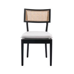 a black and white chair with a cushion on the back of it's seat