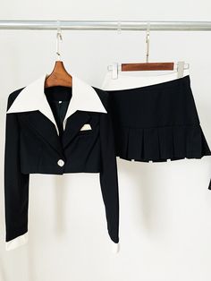 Experience the ultimate in style with this women's crop jacket and mini skirt set. The single button closure, trendy notched collar, and charming pleated mini skirt create a fashion-forward ensemble. Crafted from high-quality polyester, it guarantees both comfort and a chic look, making it perfect for the summer season. Stay effortlessly on-trend with this must-have two-piece set.Specifications Style: High Street Sleeve Style: Regular Sleeve Length(cm): Full Silhouette: Pleated Season: Summer Place Of Origin: China (Mainland) Pattern Type: Solid Pant Closure Type: Zipper Fly Origin: Mainland China Model Number: TS161 Material Composition: Natural fiber Material: Polyester Gender: WOMEN Fabric content: 81% (inclusive) - 90% (inclusive) Fabric Type: Polyester Cotton Dresses Length: Above Kne Fitted Two-piece Long Sleeve Blazer, Chic Fitted Collared Set, Fall Fitted Mini Skirt Suit, Fall Fitted Mini Length Skirt Suit, Fall Mini Length Fitted Skirt Suit, Chic Mini Length Fall Sets, Trendy Formal Sets With Long Sleeves, Chic Fall Mini Sets, Chic Fall Mini Length Sets