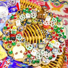 a wicker basket filled with lots of assorted buttons and magnets on top of a table