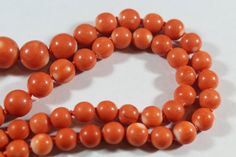 -Vintage 14k Gold Natural Japanese Momo Coral with Raw Diamond Necklace -Total length: 18.5 in -Coral size: 6.15 mm ~ 12.4 mm -Total weight: 36.3 g -Marked 14k Formal Orange Single Strand Necklace, Classic Orange Round Necklace, Classic Orange Necklace For Formal Occasions, Classic Orange Necklaces For Formal Occasions, Orange Classic Formal Necklaces, Orange Classic Formal Necklace, Vintage 8mm Beads Jewelry For Formal Occasions, Vintage Formal Jewelry With 8mm Beads, Formal Vintage Jewelry With 8mm Beads