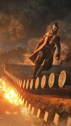 a man standing on top of a giant object in the middle of a fire filled sky