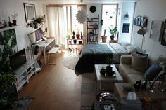 a living room filled with furniture and a flat screen tv