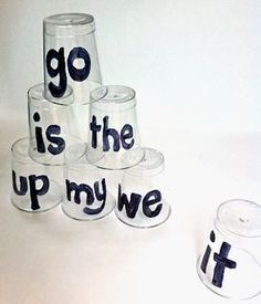 a stack of glass cups with the words go is the up my we written on them