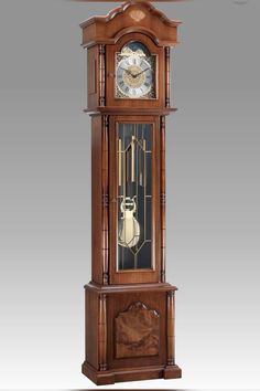 an antique grandfather clock with pendulums on the sides