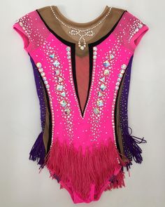 a woman's leotard with pink and purple fringes