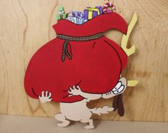 a paper cut out of a cartoon character carrying a bag with gifts on it's back