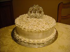 a large white cake sitting on top of a table