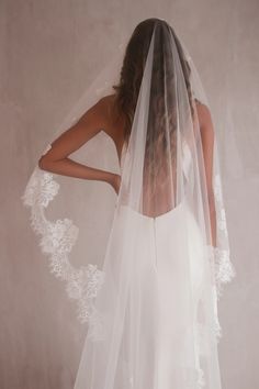 the back of a woman wearing a wedding veil