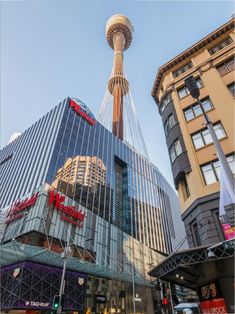 a very tall building in the middle of some buildings