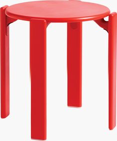 a red plastic table with two legs and a small round top on the bottom, sitting in front of a white background