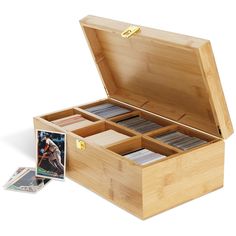 an open wooden box filled with lots of cards