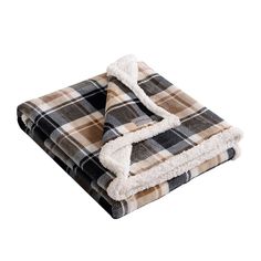 two blankets folded on top of each other with a white and brown plaid pattern in the middle