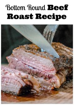 the steak is being cut into pieces with a knife and fork on top of it