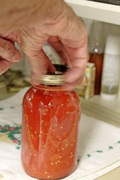 My parents have canned tomatoes for so many years, yet I have never stopped long enough to see just how they do it, so this summer I finally did.  And you know what?  It’s not that hard at all.  If you have always thought canning tomatoes (or anything for that matter) is really hard, it’s … Cook Tomatoes, Water Bath Cooking, Easy Canning, Preserving Foods, Canning Food, Canning Vegetables, Canning Tips