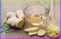 a glass cup filled with tea next to sliced up ginger