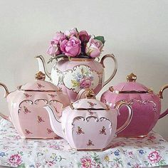 pink and white tea set with flowers in the middle