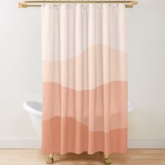 a shower curtain with an orange and pink ombretta on the bottom, in front of a white bath tub