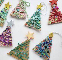 christmas tree ornaments made out of paper and string