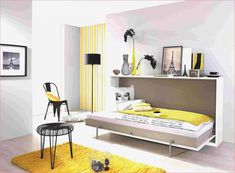 a bedroom with yellow and white decor on the walls