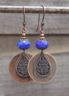 Beautiful cobalt blue, faceted Czech glass with antiqued copper coin drop and filigree teardrop. Very light weight, approx 2 in total length. Bohemian Blue Copper Earrings, Blue Teardrop Copper Earrings, Blue Pierced Copper Earrings, Blue Copper Teardrop Earrings, Blue Copper Pierced Earrings, Bohemian Blue Earrings, Blue Teardrop Brass Earrings, Blue Bohemian Teardrop Earrings Nickel Free, Nickel-free Blue Copper Jewelry