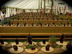 the table is set up with plates and desserts on them for an outdoor event