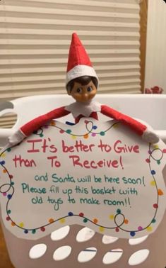 an elf is sitting on top of a basket with a sign that says, it's better to give than to receive and santa will be there soon