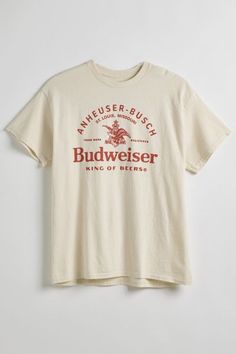 an old budweiser t - shirt hanging on a wall