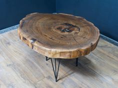 a wooden table with hairpin legs on a hard wood floor in a living room