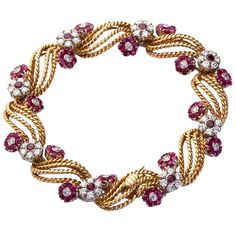 A finely crafted 18 karat diamond and ruby florets gold twirl bracelet contains ~3.00 carats of fine round cut diamonds with ~2.90 of round cut rubies. 7" long and ~5/8" wide. No. 4409 Textured Bracelet, Diamond Necklace Designs, Ruby Bracelet, Vintage Charm Bracelet, Antique Bracelets, Jewelry Bracelets Gold, Sterling Bracelets, Bracelets Gold Diamond, Tennis Bracelet Diamond